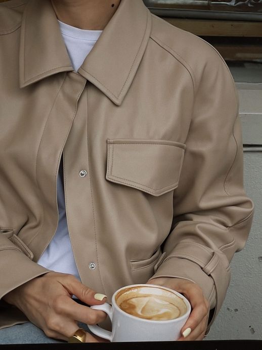 Beige short eco-leather trench coat on suede