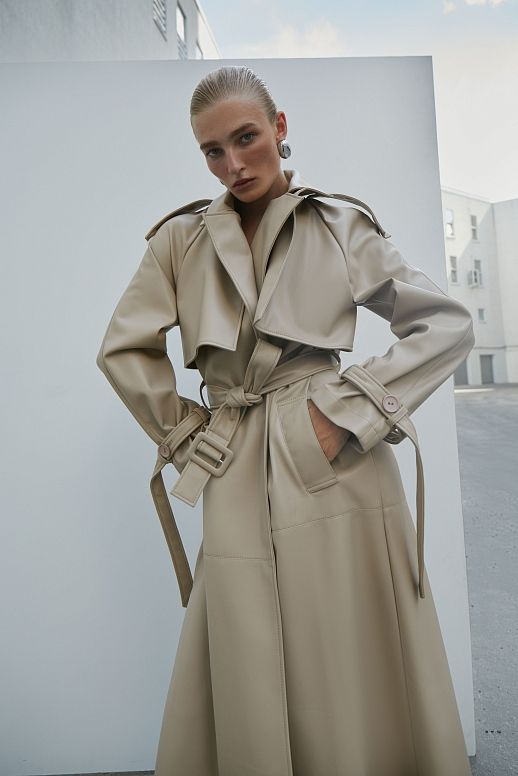 Light beige eco-leather trench coat on suede