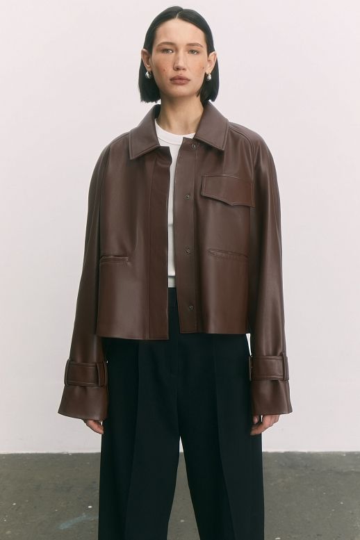 Brown short eco-leather trench coat on suede