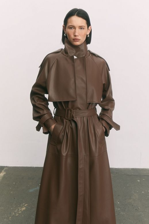 Brown eco-leather trench coat on suede